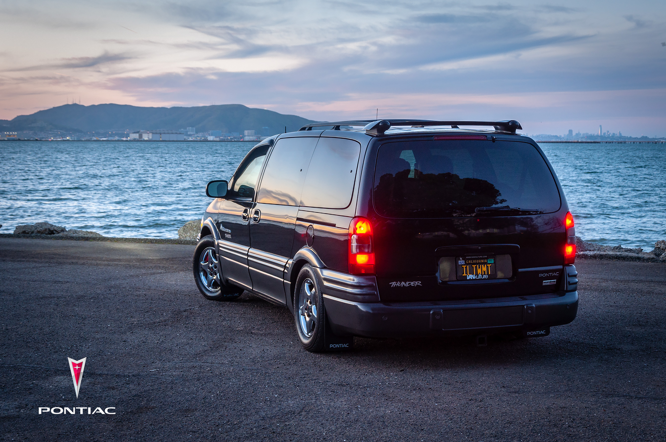 A 3/4 rear photo of 2003 AWD Pontiac Montana Thunder at sunset, overlooking SFO bay.